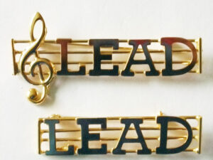 LEAD metal part name pin on a staff