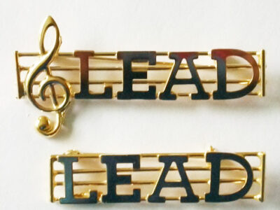 LEAD metal part name pin on a staff